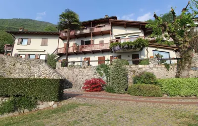 Two-room apartment in Residence with swimming pool and panoramic lake view in Sale Marasino