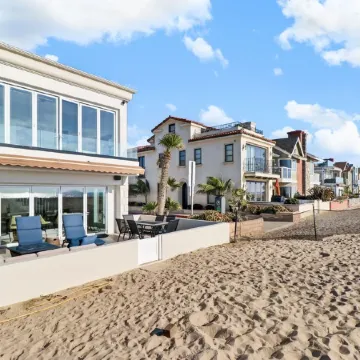 Located directly on the Sand. Two Master Suites, four bedrooms, four bathrooms.