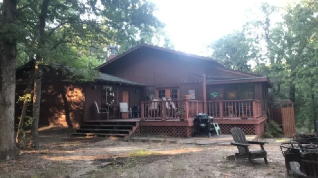 Private lakefront getaway with a sandy beach below the back deck!