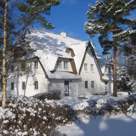 Holiday apartment on the beach in a traditional thatched-roofed house
