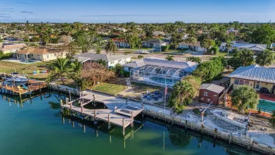 Tropical oasis on the water. Heated pool w. lots of family amenities & games