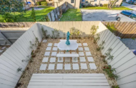 Private Balcony and Tropical Patio Retreat - Stylish Coastal Haven