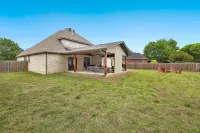 Outdoor Patio with TV and Fire Pit for Relaxation - Charming Oasis
