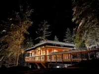 House with bridge, walk around deck, rooftop patio, 24' glass door & much more!!