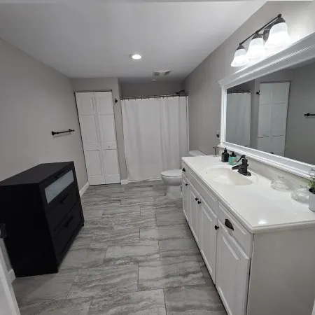 A clean luxury suite on a lakeside view with city amenities within 5 minutes.