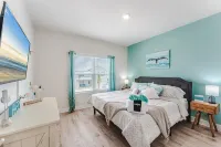 Beach House with Golf Cart, Grill & Two Pools!