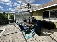 Tropical Oasis sleeps 13 with a heated pool.  Free WiFi.  Close to everything