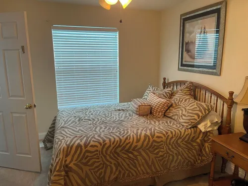 Lakefront home with white sand beach and private boat dock on Crooked Lake.