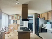 Comfy Mobile Home located minutes from restaurants and venues.