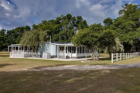 Charming farm with 2 homes, horse stables and heated pool ~ 5+ bedrooms near WEC