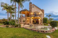 Castle on a hill, breathtaking views, surrounded with pools, trees, and lawn