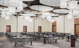 a large conference room with rows of tables and chairs , set up for a meeting or event at The Hotel at Oberlin