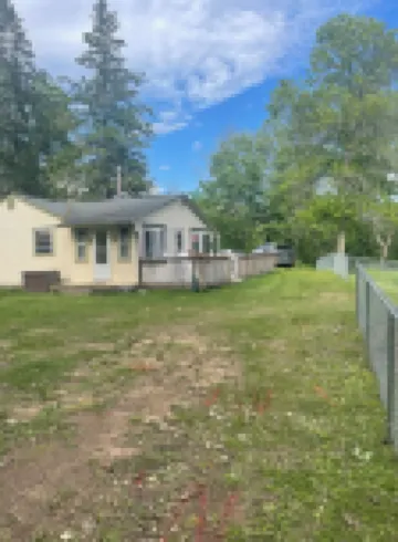 Cute Cabin on Big Pine Lake with a Large Fenced Yard and Lake Access