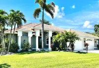WOW! Luxury Punta Gorda waterfront home; HEATED POOL, golf community; WOW factor Hotels near Publix Super Market at Burnt Store Marketplace