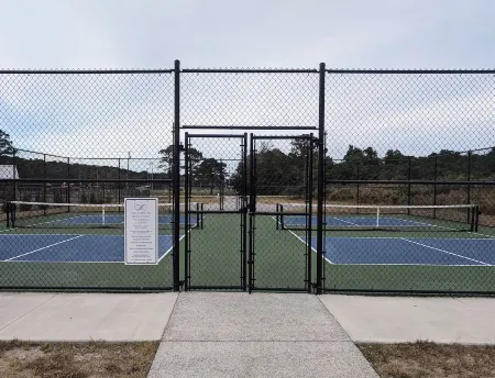 Enjoy sea breezes from double-decker porch -  walk to pool, private waterfront.