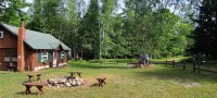 Wood Haven Lodge. Secluded, cozy log cabin in Northern Michigan.