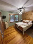 Creekfront Cabin with Waterfall. Hot Tub, Fire Pit, Gameroom, and more.