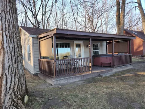 Riverfront Cottage with Hot Tub, Kayaks, Canoes, & Fishing Boats!