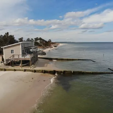 Modern Beachfront Cottage with Endless Bay Views
