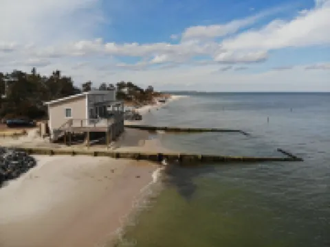 Modern Beachfront Cottage with Endless Bay Views