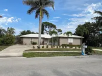 Marco Island private tropical gem of a home with large oasis style pool lanai.