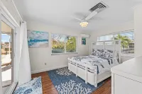 Tropical oasis on the water. Heated pool w. lots of family amenities & games