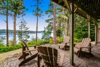 Dog-friendly waterfront home with furnished deck, patio & beach access