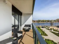 Apartment by Dziwna River with Spa & Pool Hotels in Dziwnow