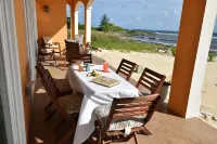 SAND Luxurious Tranquility on a Private Beach In A Protected Marine Environment