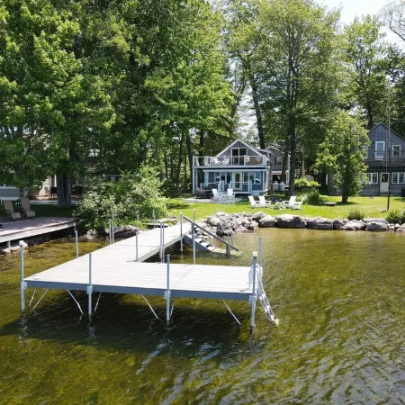 Relax in Raymond's lakefront 2-bedroom vacation home, just steps to Sebago Lake
