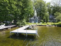 Relax in Raymond's lakefront 2-bedroom vacation home, just steps to Sebago Lake
