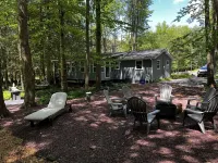 Romantic Pocono Lake Chalet: Firepit, Stream, near Lake, pools & Pet-Friendly