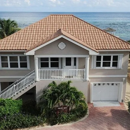 Coco Kai Beach Front Villa with Heated Pool and Private Dock