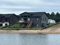 Sunset Lake Paradise new 4-bedroom lake house with private beach, WiFi, and AC
