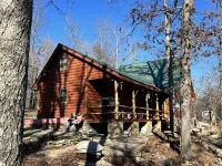 Log cabin on 9 acres. Perfect for a winter retreat or summer trip to the river.
