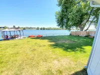 Lakefront Getaway. Private Waterfront Home with Dock and Sunroom.