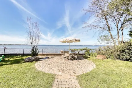 Charming 3-bedroom lakefront house with large yard and sandy beach