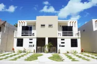 Beautiful condo in a secured community! Close to Cancun! 5 min drive to beach!