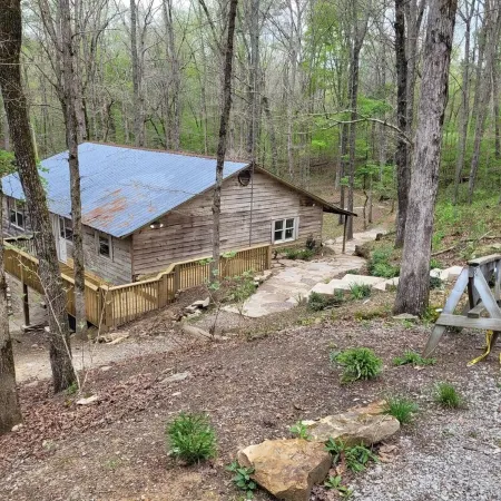Historic Cabin in a natural setting with waterfalls and covered bridge