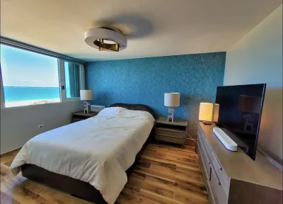 The BEACH PAD- A Beachfront,  Full Ocean View Apartment