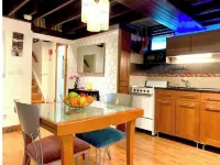 Live in this iconic East Side lower level apartment