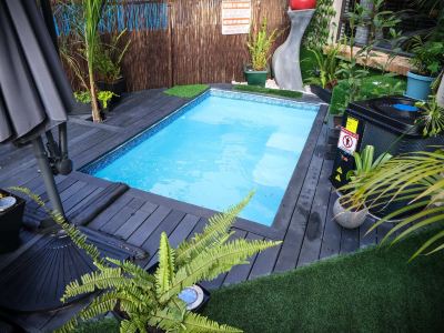 Luxury 2-Bedroom Apartment Near or Tambo with Private Garden & Heated Pool