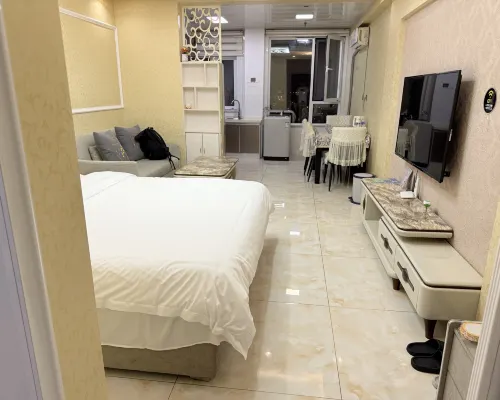 Qingyun Boutique Vacation Apartment (Weihai High-Speed Railway Station Hanlefang) Zimmer Photos