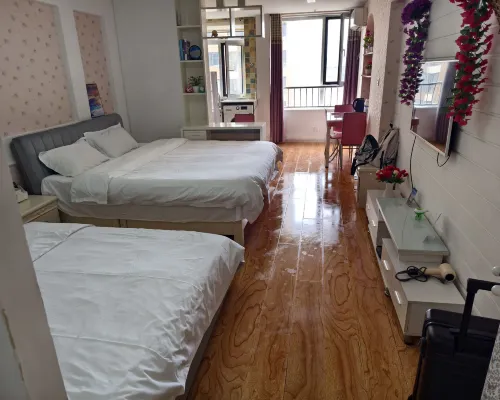 Qingyun Boutique Vacation Apartment (Weihai High-Speed Railway Station Hanlefang) Zimmer Photos