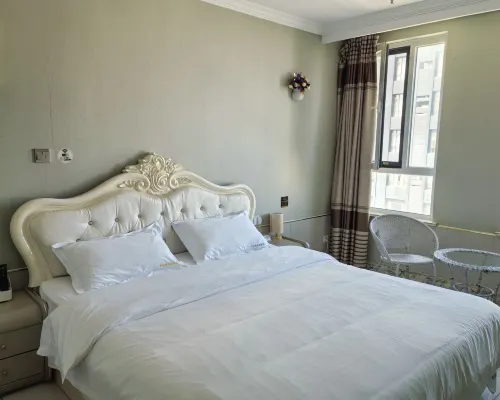 Qingyun Boutique Vacation Apartment (Weihai High-Speed Railway Station Hanlefang) Zimmer Photos