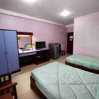 โรงแรมเมโทรเรสซิเดนซ์ (บุญเที่ยงแมนชั่น) Rooms