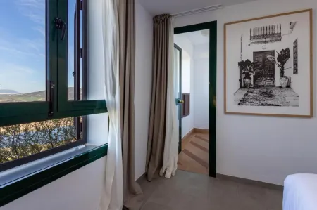 Hotel Tugasa Arco de la Villa Отели в г. Альгодоналес