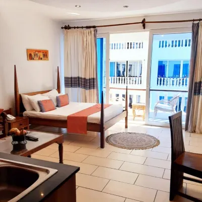 Cowrie Shell Beach Apartments Official Hotels near Nguuni Wildlife Sanctuary