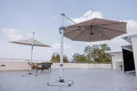 Q-Plus Apartments