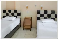 Hotel Maharani Syariah Mitra RedDoorz Hotel dekat Onex Sport